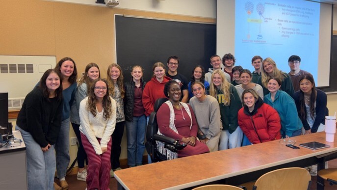 Dr. Komabu-Pomeyie with students in the classroom