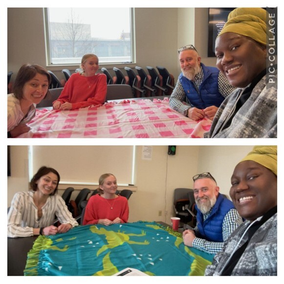 CNHS staff making fleece blanket together