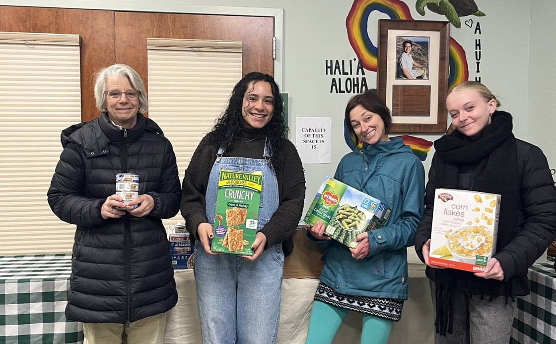 CNHS staff donating food to Rally Cat's Cupboard