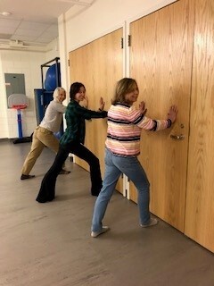 staff take a wellness yoga class