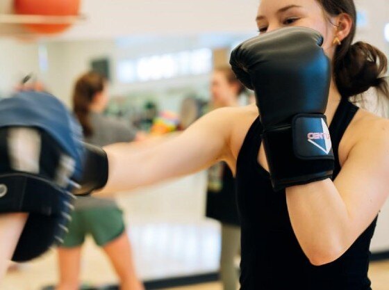 A UVM student practices kickboxing