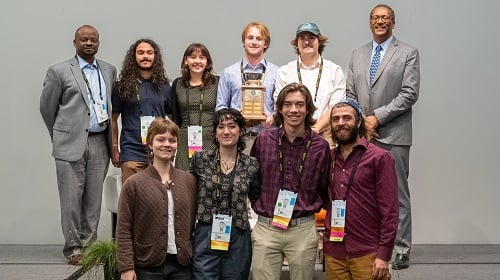 UVM Forestry Program Quiz Bowl team with their trophy and SAF CEO and USDA Forest Service Chief